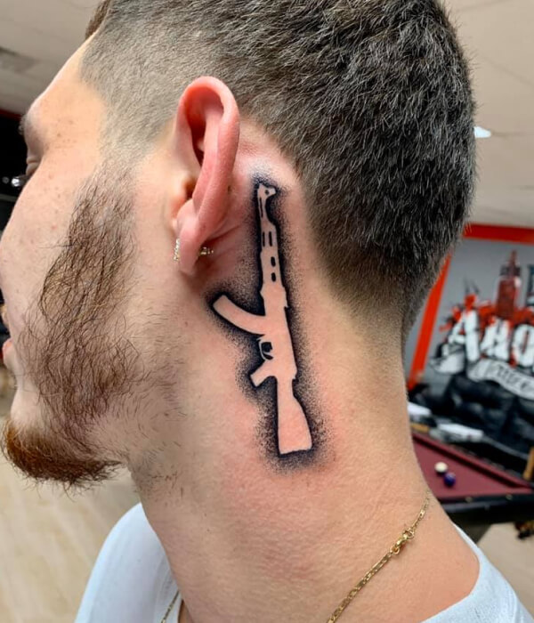 AK 47 tattoo on Neck