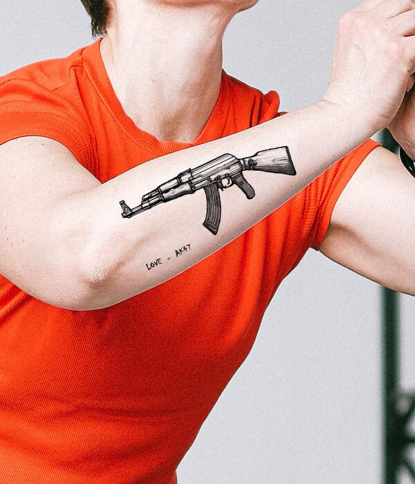 AK 47 tattoo on arm