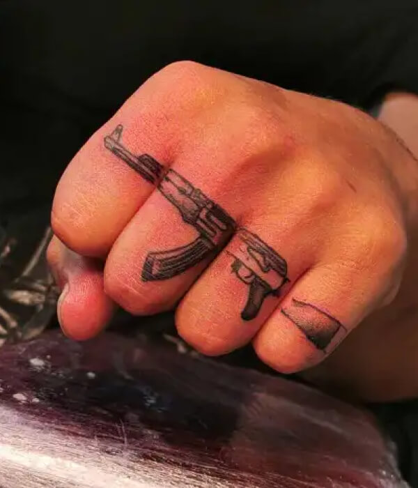 AK 47 tattoo on hand
