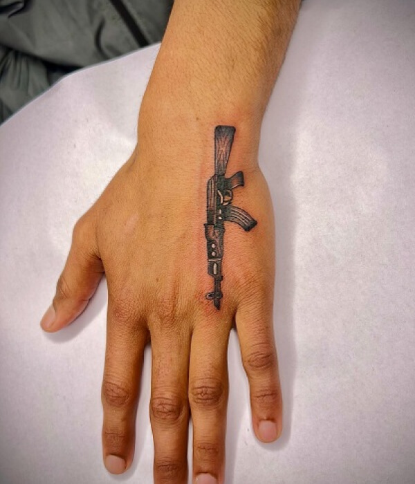 AK 47 tattoo on hand