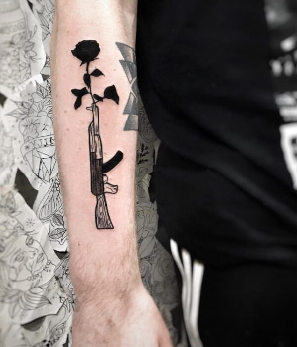 AK 47 tattoo with rose
