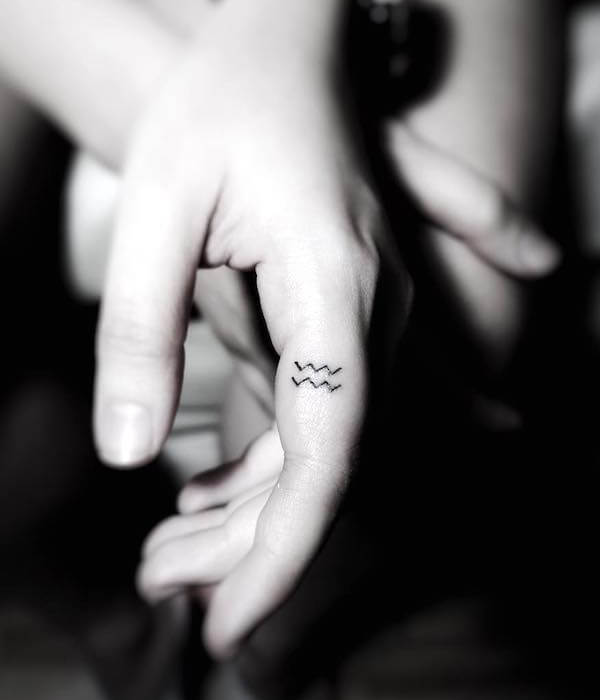 Aquarius tattoo finger