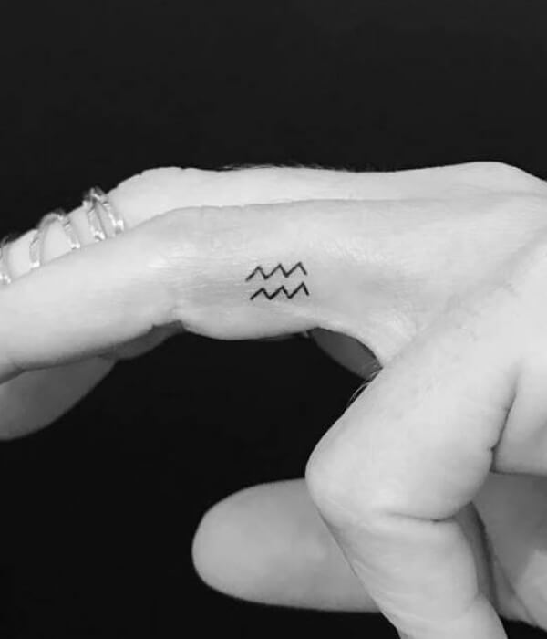 Aquarius tattoo finger