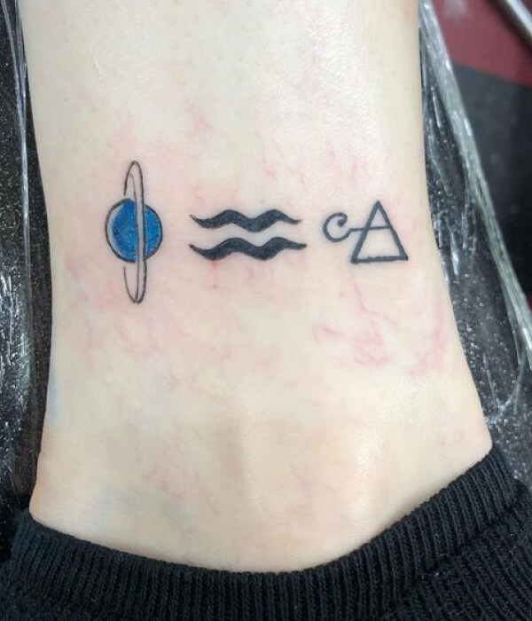 Aquarius tattoo with planets