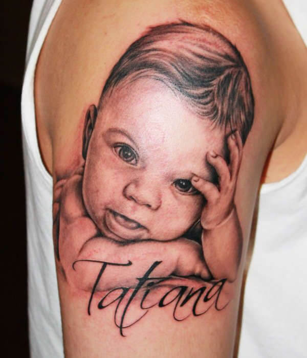 Baby face with name tattoo