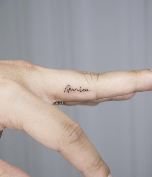 Baby name tattoo on fingers
