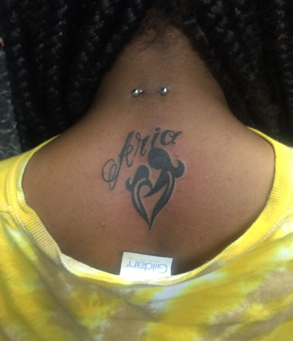 Baby name tattoo on the back of the head