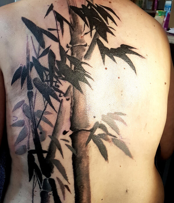 Bamboo tattoo with flowers