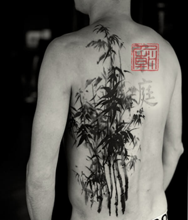 Black and grey bamboo tattoo on the back