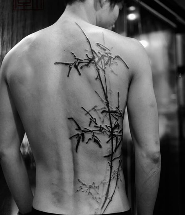 Black and grey bamboo tattoo on the back