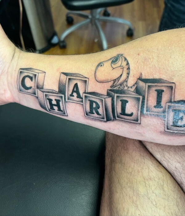 Block letter baby name tattoo
