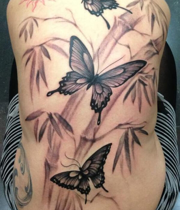 Colorful bamboo tattoo with butterflies