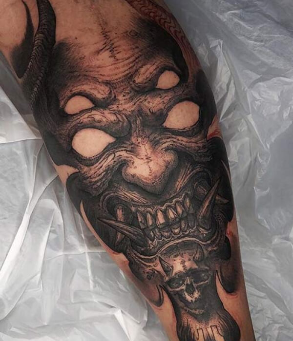 Devil arm tattoo