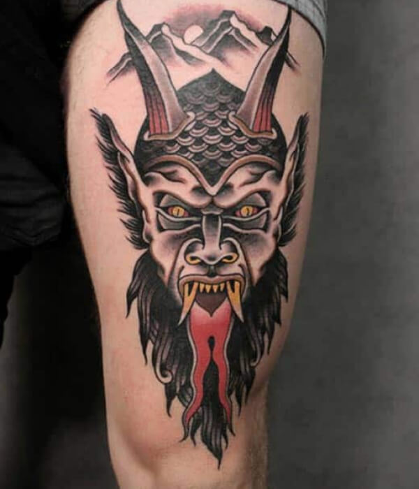 Devil tongue striking out tattoo