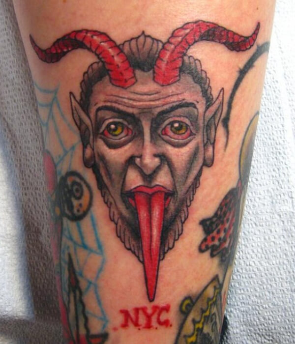 Devil tongue striking out tattoo