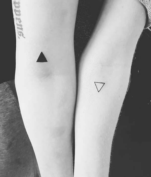 Geometrical sister tattoos