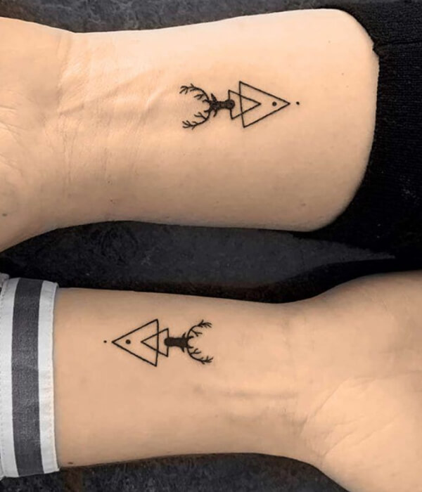 Geometrical sister tattoos