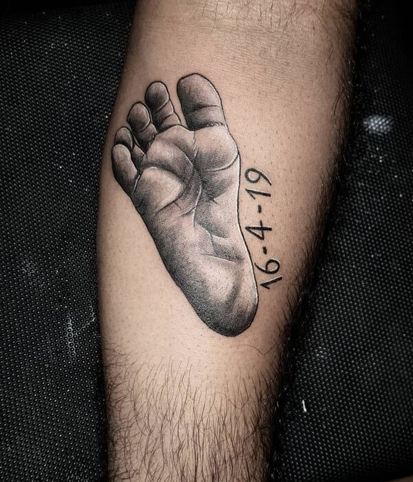 Little baby feet tattoo