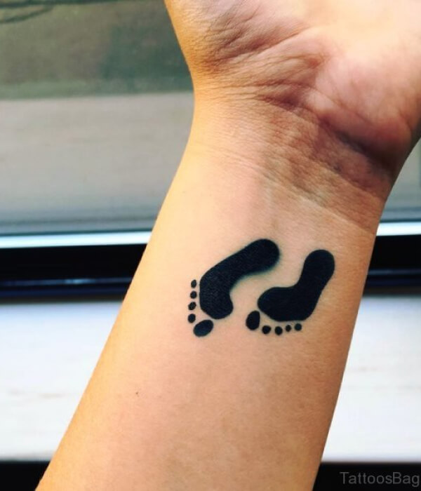 Little baby feet tattoo