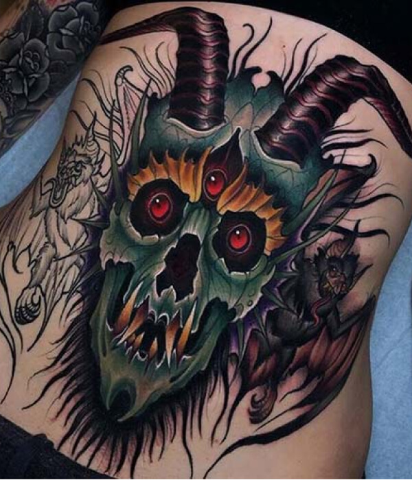 Lower waist devil tattoo