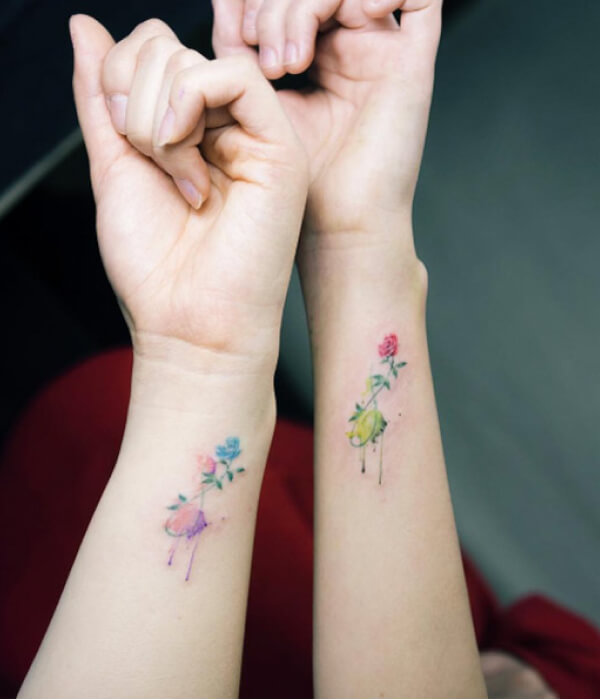 Matching pieces watercolor wrist tattoo