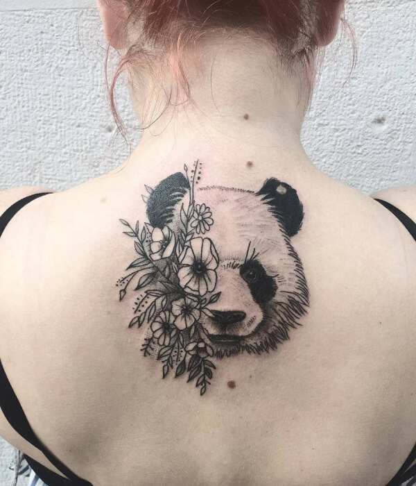 Panda tattoo with flowers