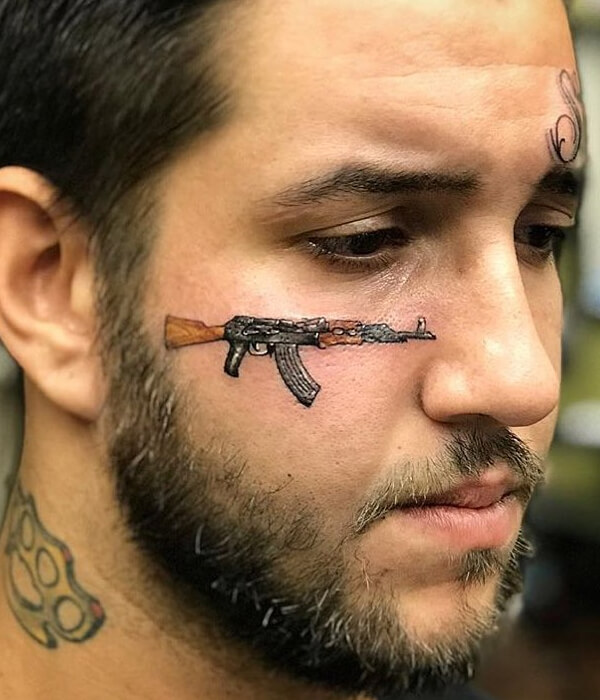 Realistic AK 47 tattoo