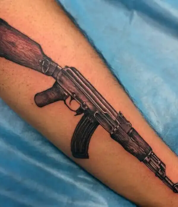 Realistic AK 47 tattoo