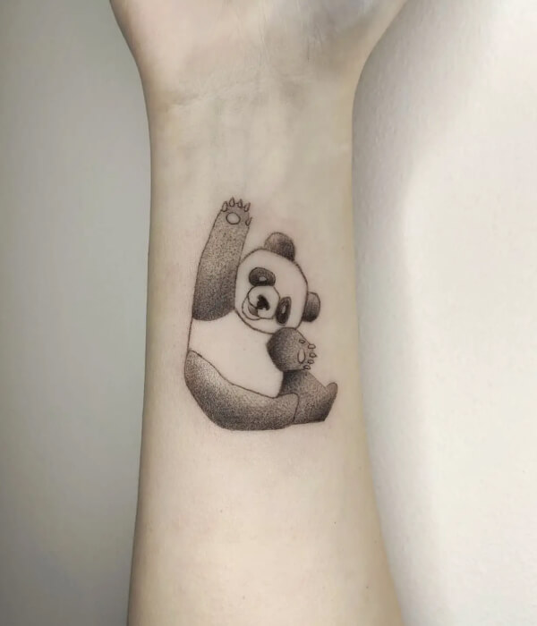 Single needle baby panda tattoo on the forearm