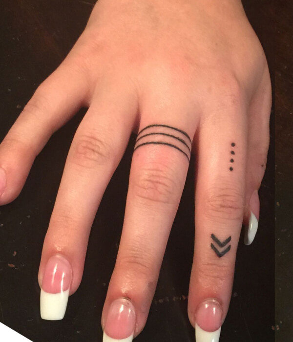 Small Aquarius symbol on the finger