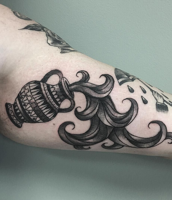 Traditional Aquarius tattoo on the arm