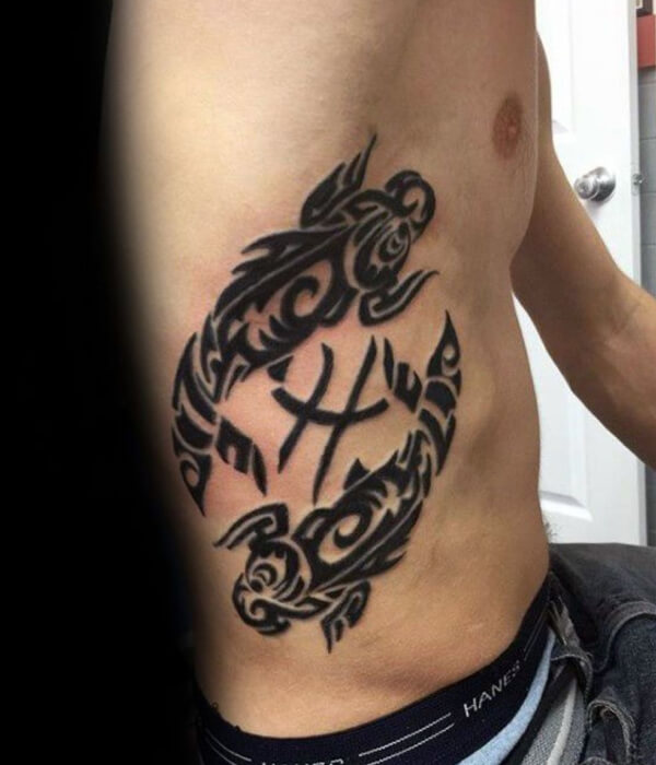 Tribal Pisces tattoo