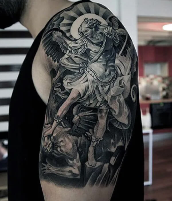 Upper arm devil tattoo