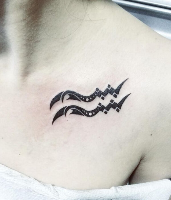 Waves with the inscription Aquarius tattoo