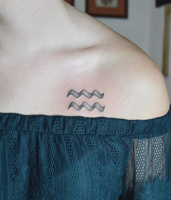 Waves with the inscription Aquarius tattoo