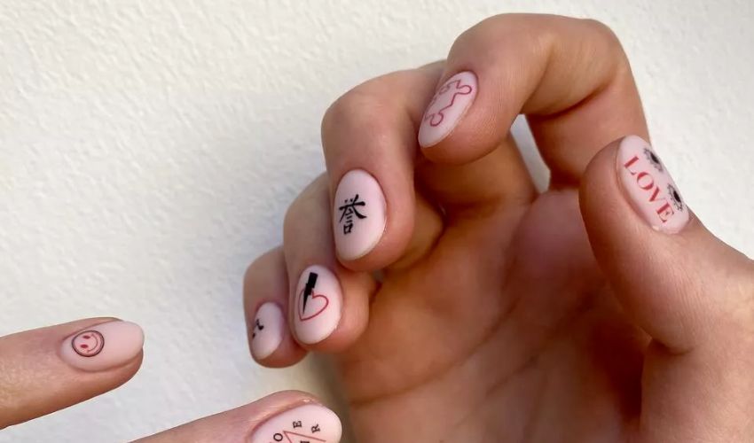 pink love nail tattoo