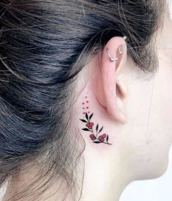 A small plant near the ear tattoo