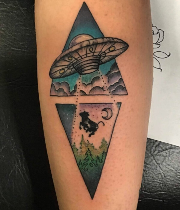 Alien and rocket tattoo