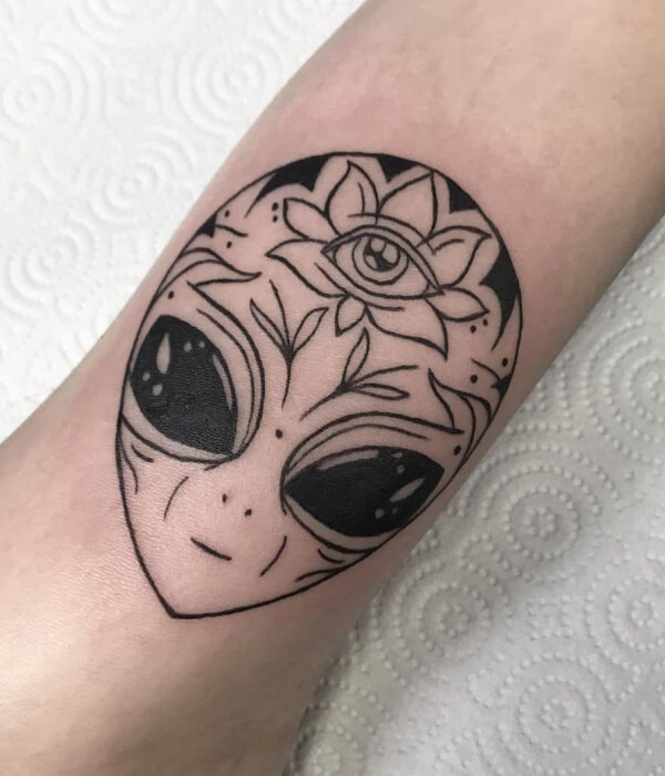 Alien head tattoo