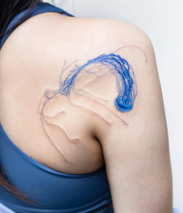 Blue jellyfish tattoo