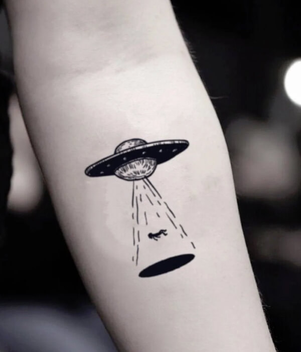 Cartoon UFO tattoo