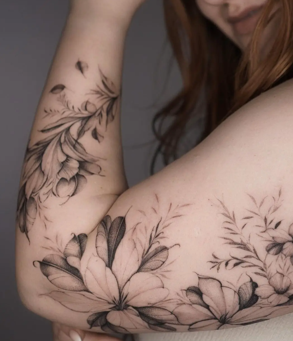 Entangled flowers and plants tattoo