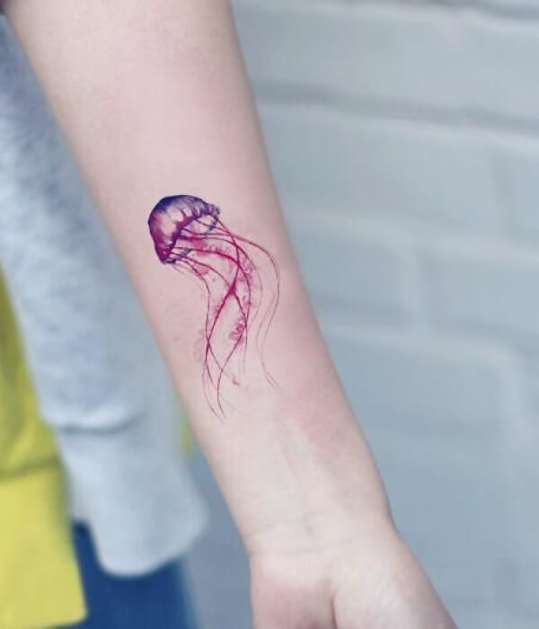 Forearm jellyfish tattoo