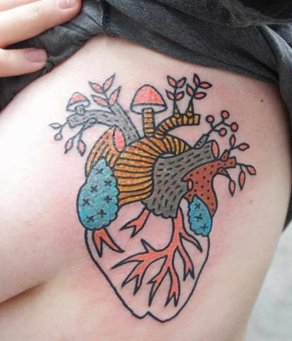 Heart with mushroom and plant tattoo