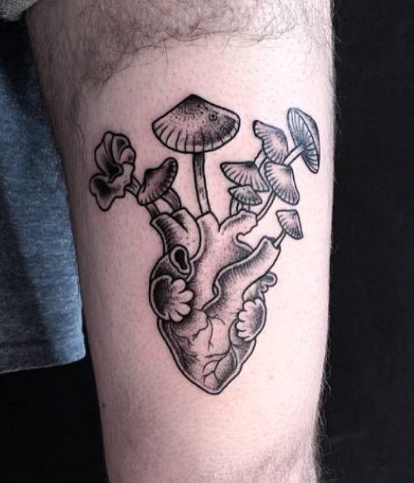 Heart with mushroom and plant tattoo