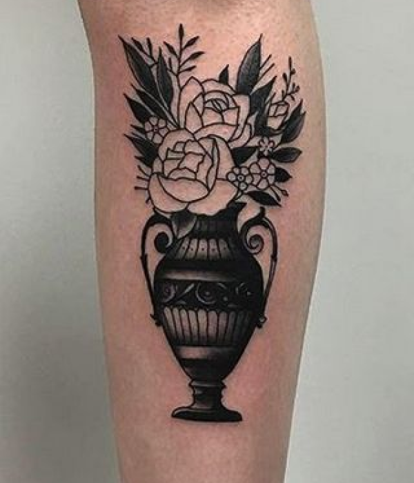 Plant in a vase tattoo