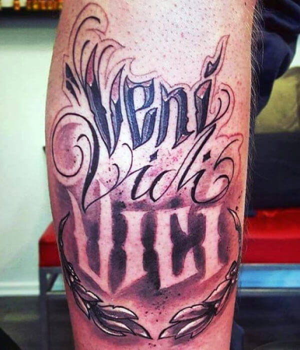 Veni Vidi Vici tattoo on the thigh