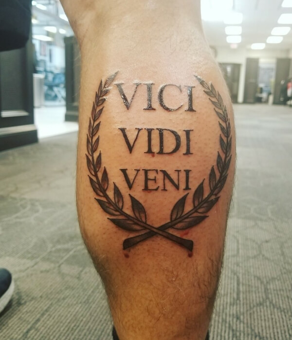 Veni Vidi Vici tattoo on the thigh