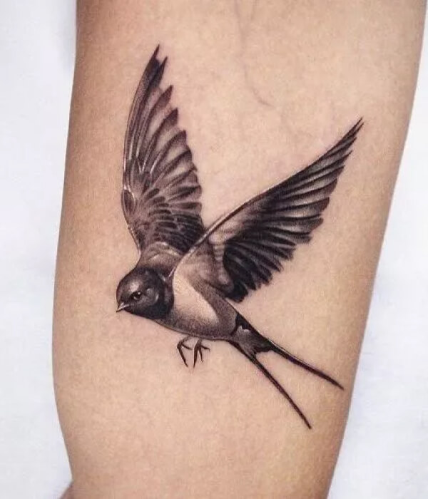 A sparrow in flight tattoo