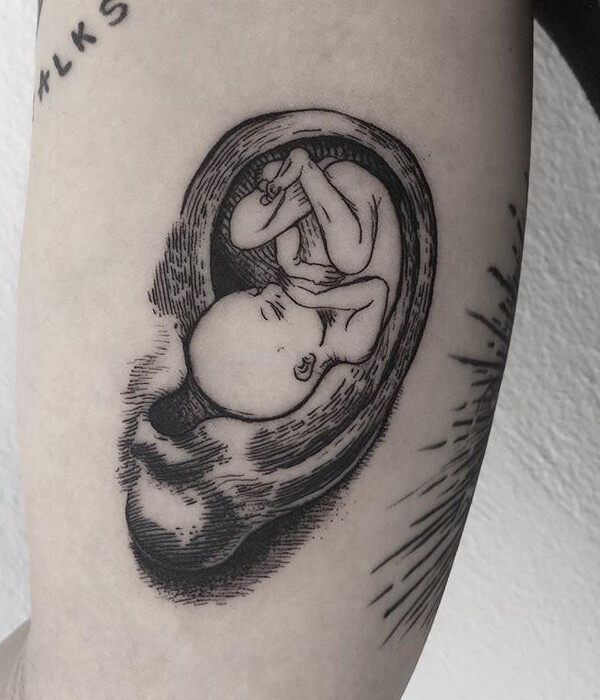 Baby in the womb tattoo